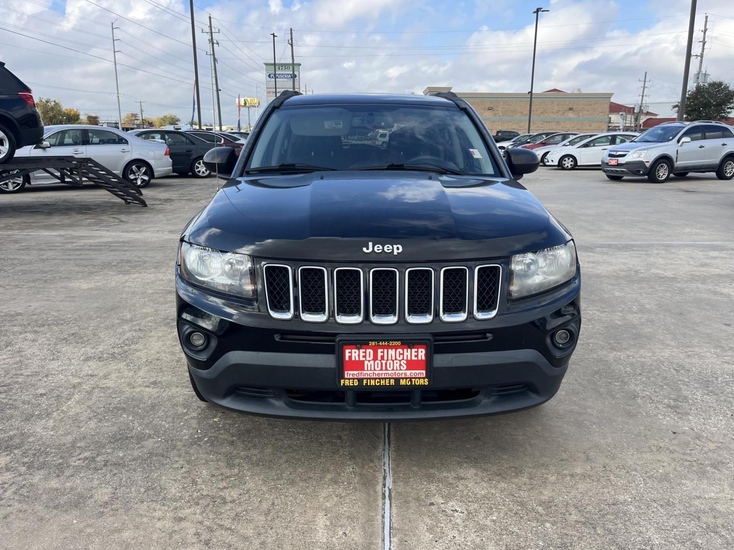 2014 black Jeep Compass Sport FWD (1C4NJCBAXED) with an 2.0L L4 DOHC 16V engine, located at 14700 Tomball Parkway 249, Houston, TX, 77086, (281) 444-2200, 29.928619, -95.504074 - Photo#1