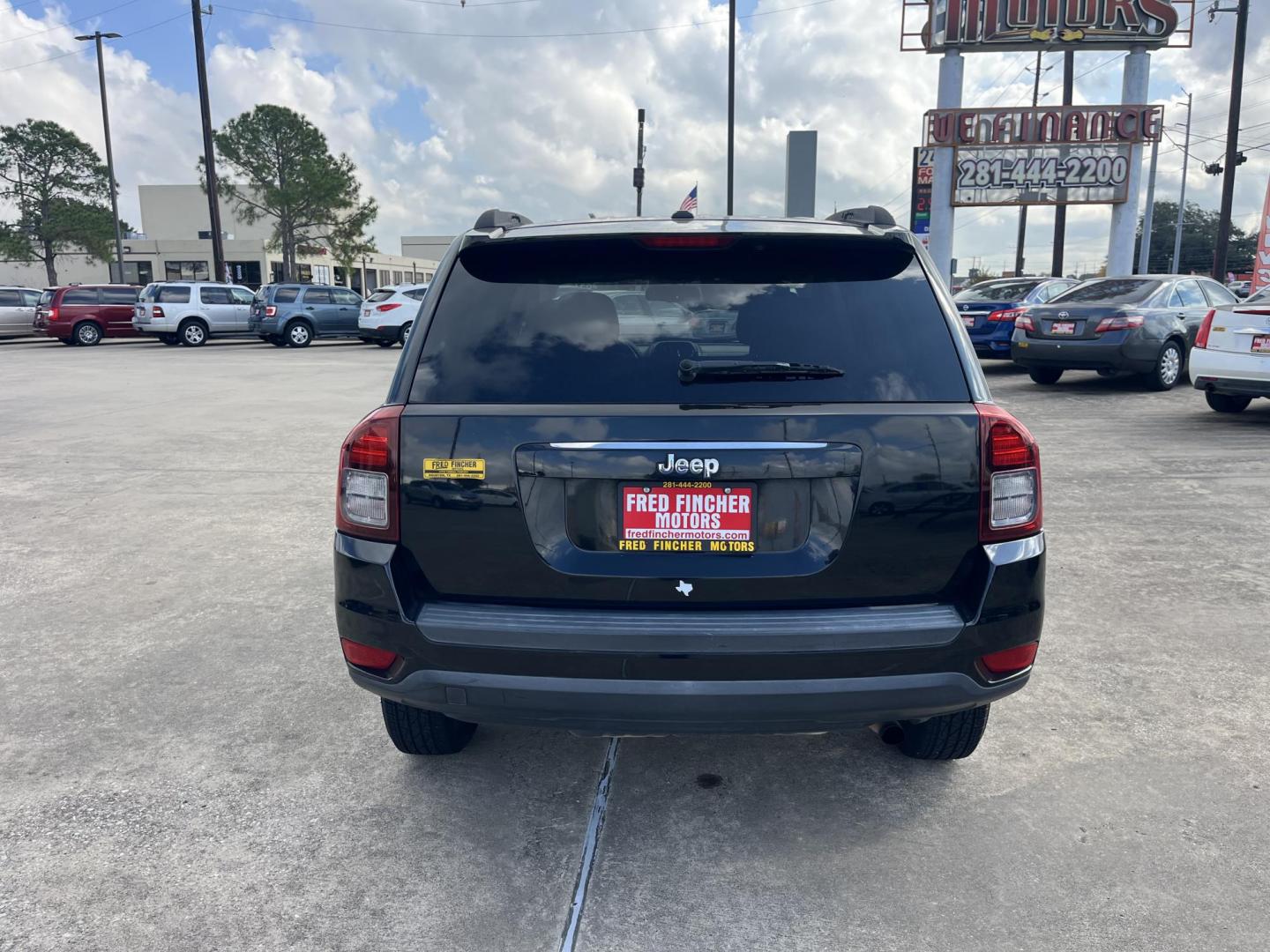 2014 black Jeep Compass Sport FWD (1C4NJCBAXED) with an 2.0L L4 DOHC 16V engine, located at 14700 Tomball Parkway 249, Houston, TX, 77086, (281) 444-2200, 29.928619, -95.504074 - Photo#5