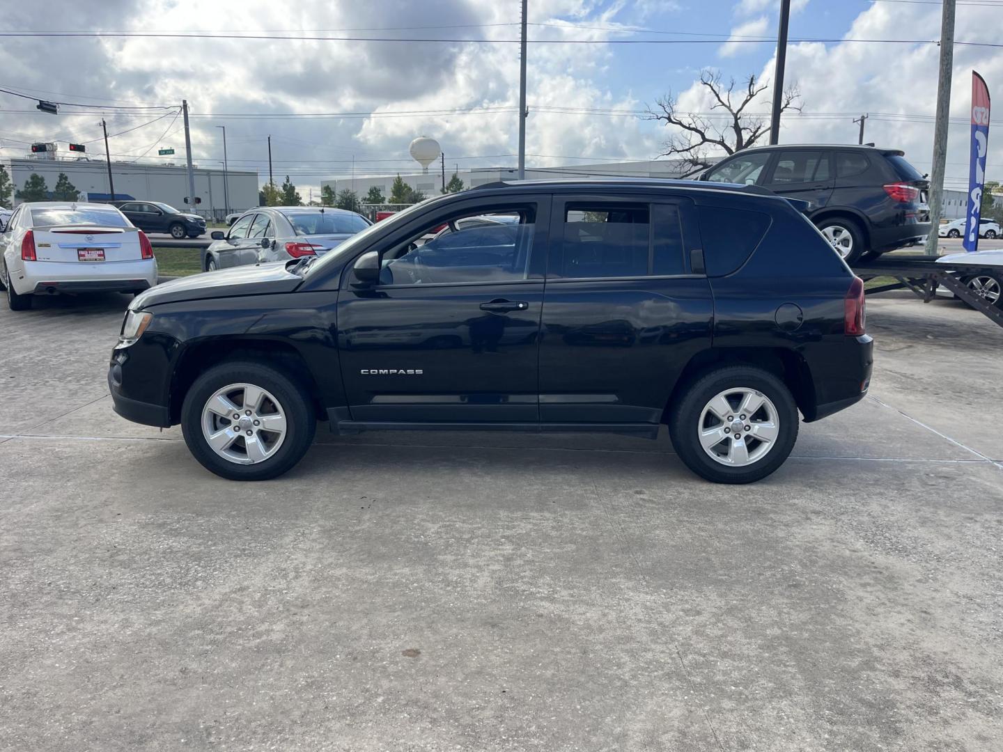 2014 black Jeep Compass Sport FWD (1C4NJCBAXED) with an 2.0L L4 DOHC 16V engine, located at 14700 Tomball Parkway 249, Houston, TX, 77086, (281) 444-2200, 29.928619, -95.504074 - Photo#3