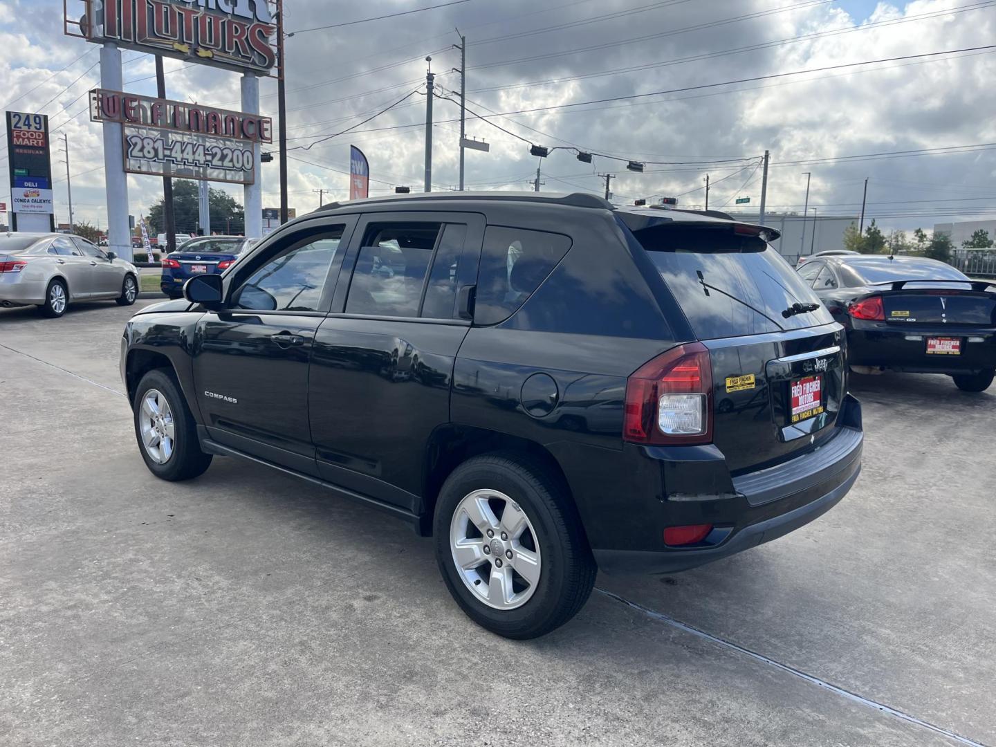 2014 black Jeep Compass Sport FWD (1C4NJCBAXED) with an 2.0L L4 DOHC 16V engine, located at 14700 Tomball Parkway 249, Houston, TX, 77086, (281) 444-2200, 29.928619, -95.504074 - Photo#4