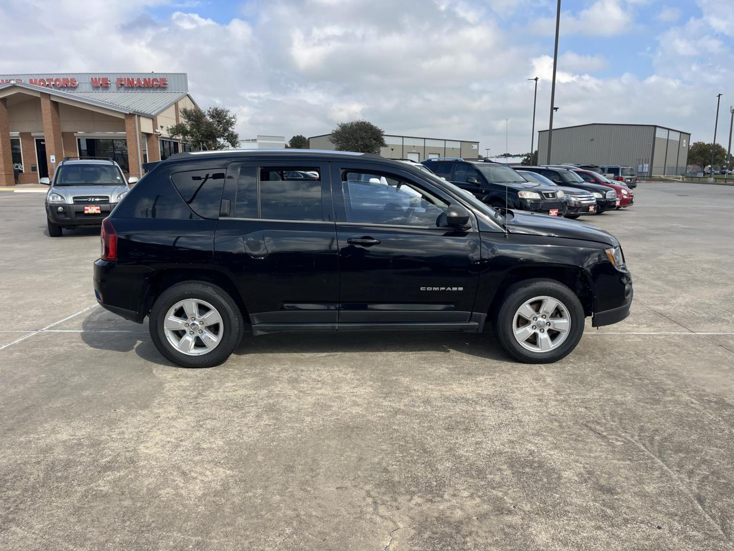 2014 black Jeep Compass Sport FWD (1C4NJCBAXED) with an 2.0L L4 DOHC 16V engine, located at 14700 Tomball Parkway 249, Houston, TX, 77086, (281) 444-2200, 29.928619, -95.504074 - Photo#7