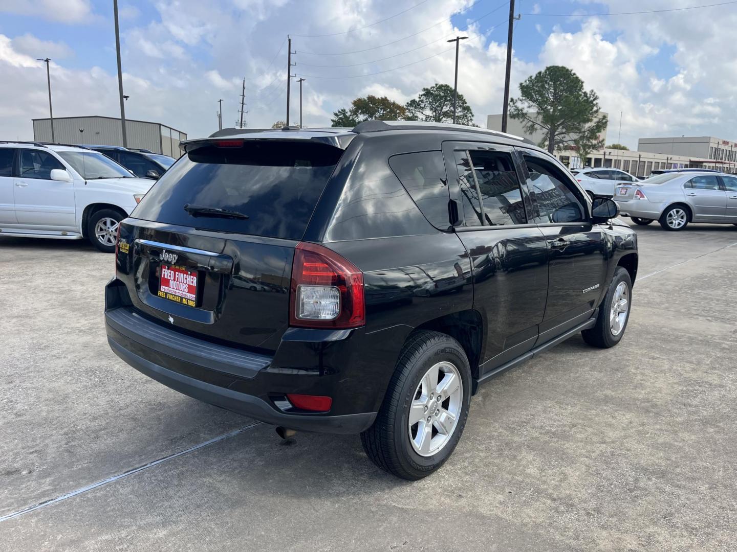 2014 black Jeep Compass Sport FWD (1C4NJCBAXED) with an 2.0L L4 DOHC 16V engine, located at 14700 Tomball Parkway 249, Houston, TX, 77086, (281) 444-2200, 29.928619, -95.504074 - Photo#6