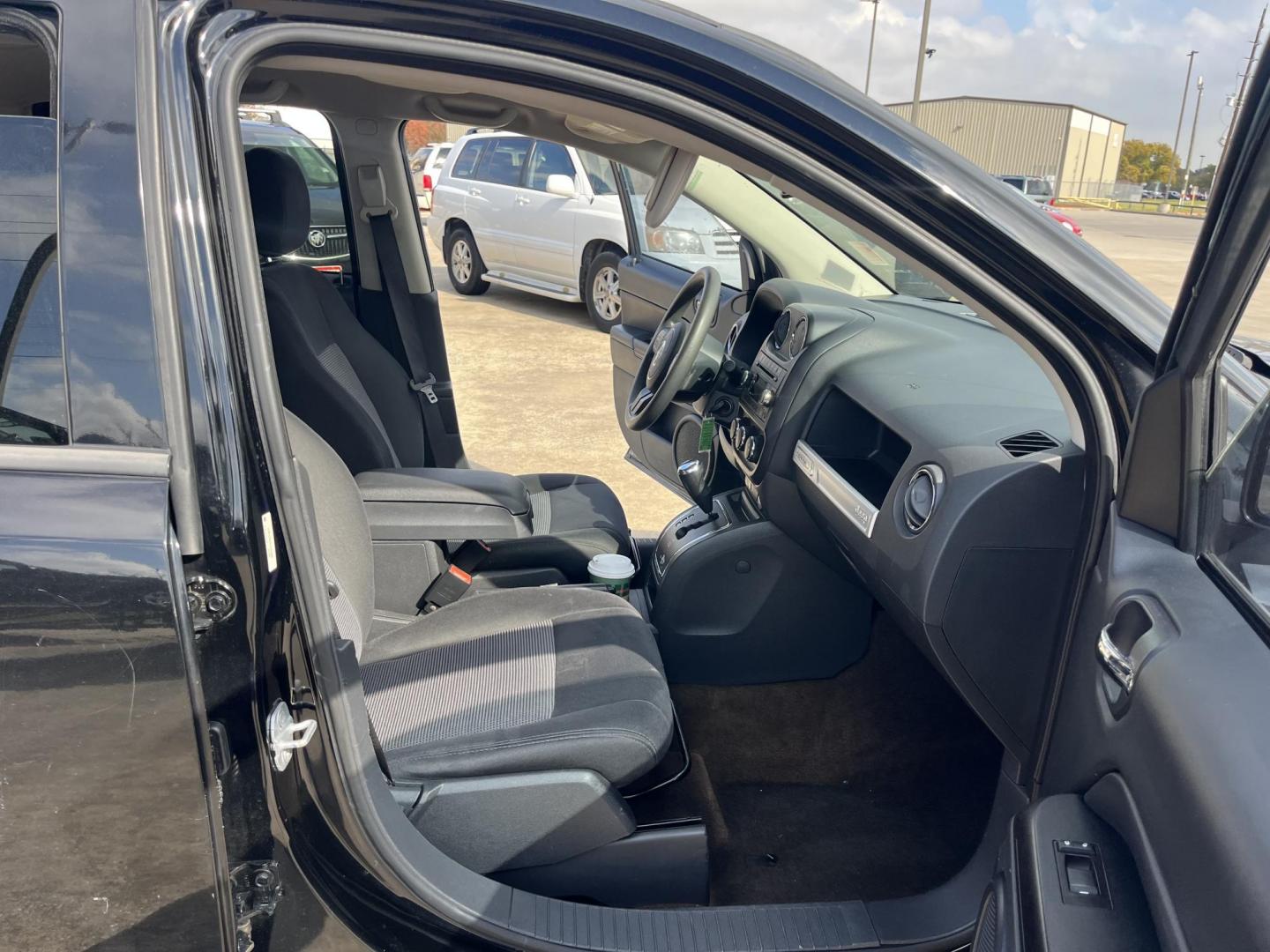 2014 black Jeep Compass Sport FWD (1C4NJCBAXED) with an 2.0L L4 DOHC 16V engine, located at 14700 Tomball Parkway 249, Houston, TX, 77086, (281) 444-2200, 29.928619, -95.504074 - Photo#11