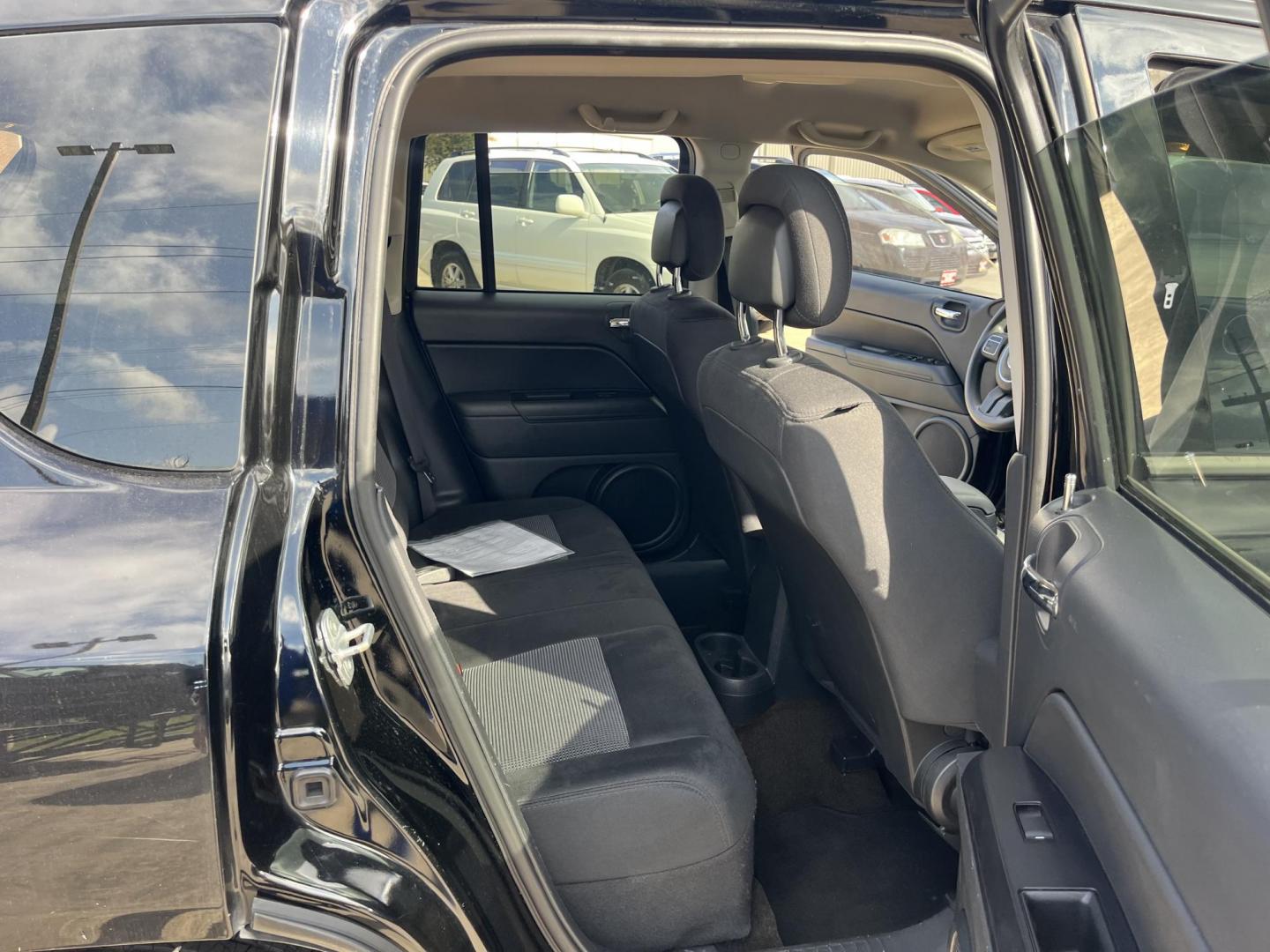 2014 black Jeep Compass Sport FWD (1C4NJCBAXED) with an 2.0L L4 DOHC 16V engine, located at 14700 Tomball Parkway 249, Houston, TX, 77086, (281) 444-2200, 29.928619, -95.504074 - Photo#12