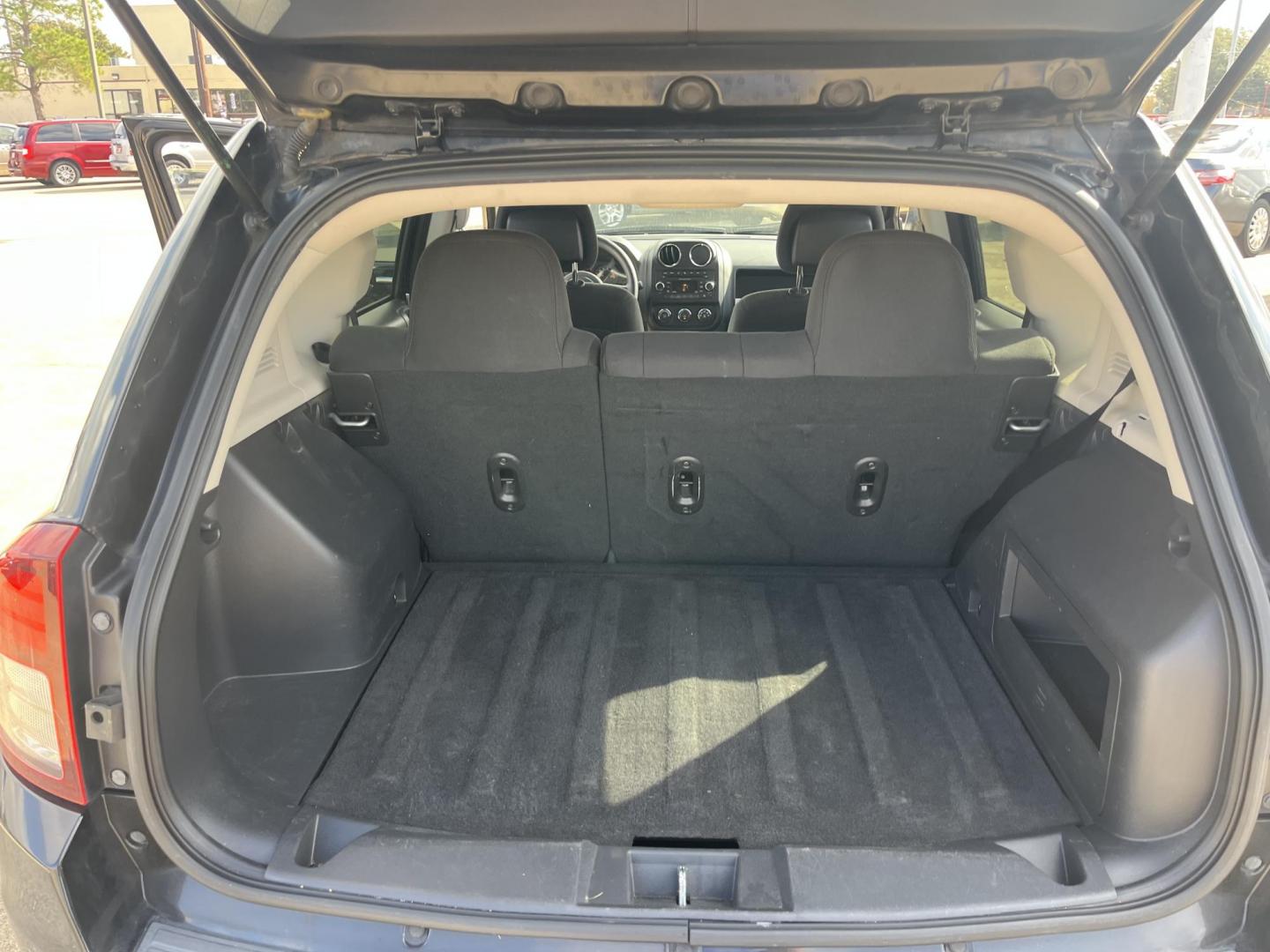 2014 black Jeep Compass Sport FWD (1C4NJCBAXED) with an 2.0L L4 DOHC 16V engine, located at 14700 Tomball Parkway 249, Houston, TX, 77086, (281) 444-2200, 29.928619, -95.504074 - Photo#13