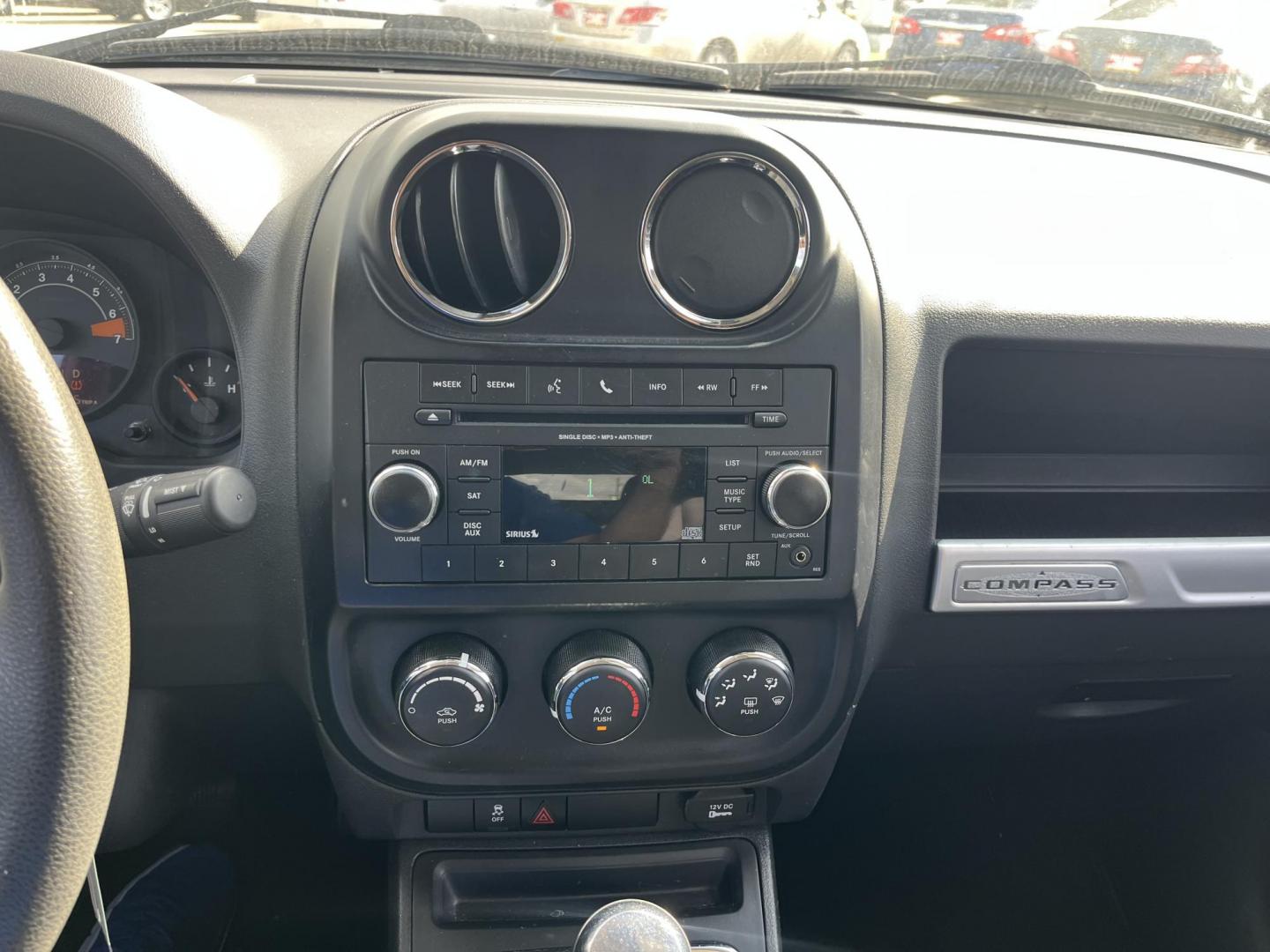 2014 black Jeep Compass Sport FWD (1C4NJCBAXED) with an 2.0L L4 DOHC 16V engine, located at 14700 Tomball Parkway 249, Houston, TX, 77086, (281) 444-2200, 29.928619, -95.504074 - Photo#15