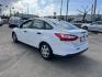2014 white Ford Focus S Sedan (1FADP3E22EL) with an 2.0L L4 DOHC 16V engine, located at 14700 Tomball Parkway 249, Houston, TX, 77086, (281) 444-2200, 29.928619, -95.504074 - Photo#4