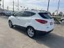 2012 white Hyundai Tucson Limited 2WD (KM8JU3ACXCU) with an 2.4L L4 DOHC 16V engine, 6-Speed Automatic transmission, located at 14700 Tomball Parkway 249, Houston, TX, 77086, (281) 444-2200, 29.928619, -95.504074 - Photo#4